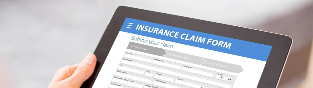 Tablet with online insurance claim form displayed