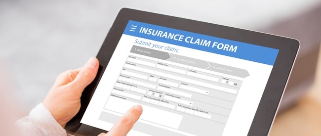 Tablet with online insurance claim form displayed
