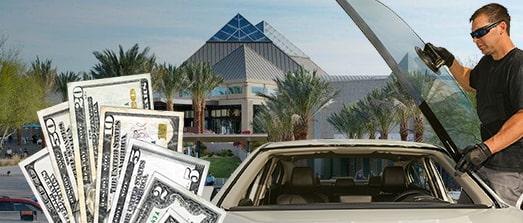 Technician fixing glass on Arrowhead Mall street