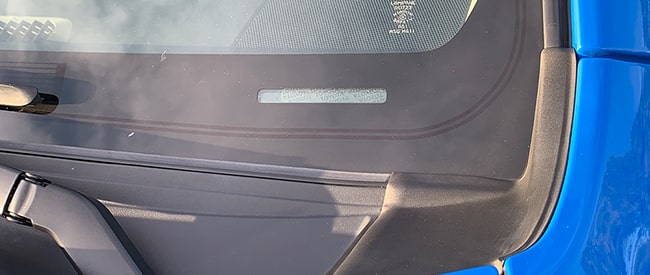 Blue Toyota SUV windshield showing VIN
