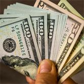 Hand holding cash back