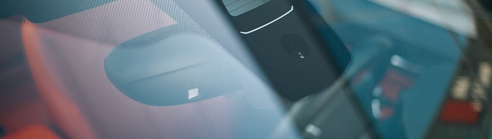 Close Up of Water Light Sensor on Windshield