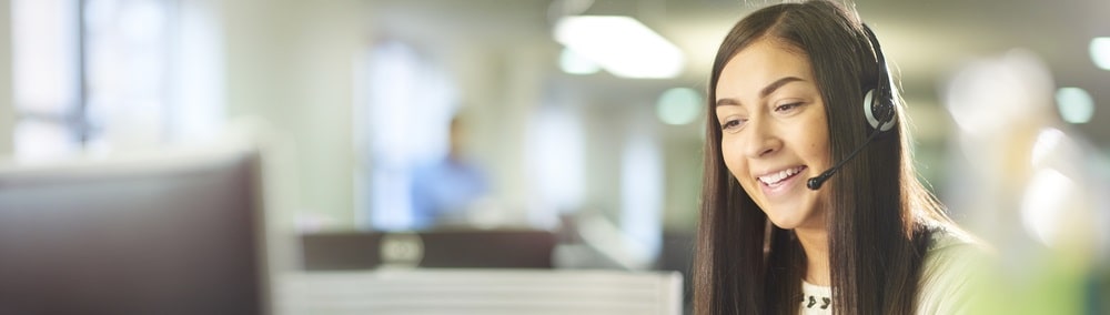 Smiling customer service woman on phone