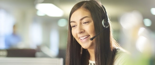 Smiling customer service woman on phone