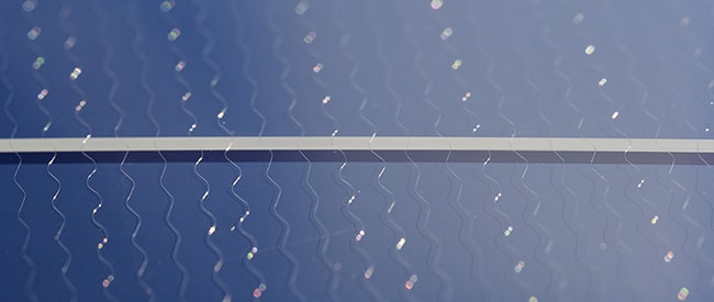 Cracked windshield with wire heating element grid
