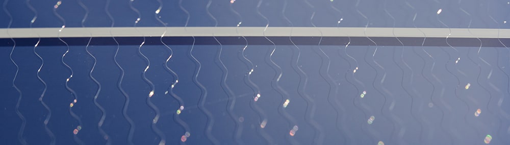 Cracked windshield with wire heating element grid
