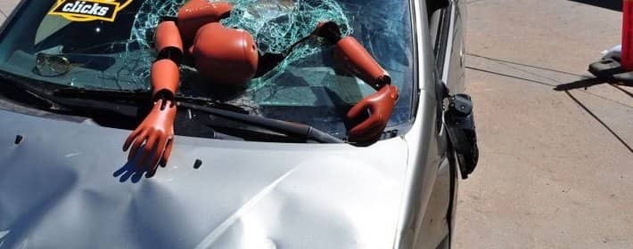 Crash dummy that has gone through the windshield after an accident