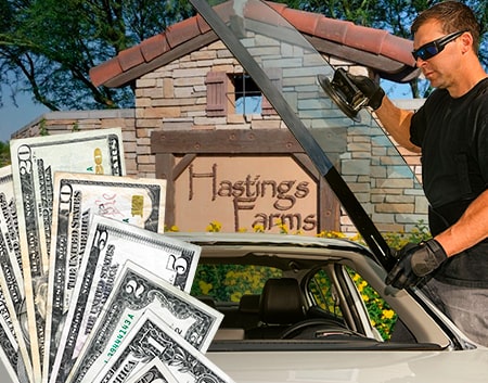 Technician fixing glass on Hastings Farms street