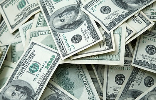 Large pile of United States 100 dollar bills