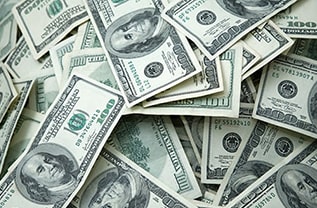 Large pile of United States 100 dollar bills