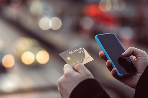 Man paying with credit card by phone