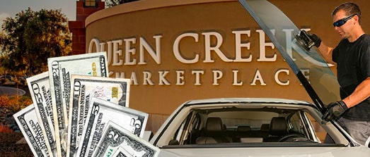 Technician fixing glass on Queen Creek Marketplace street