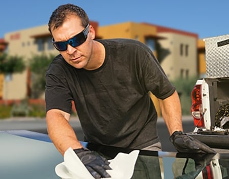 Technician fixing glass on Phoenix street