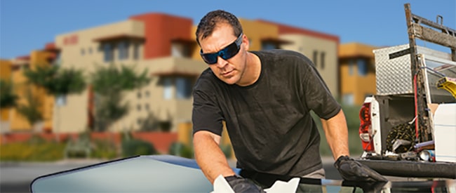 Technician fixing glass on Phoenix street
