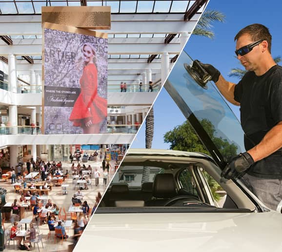 Mobile auto glass technician replacing a windshield at Fashion Square in Scottsdale, AZ