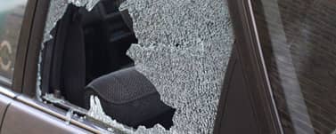 Completely shattered front door glass on car thumbnail