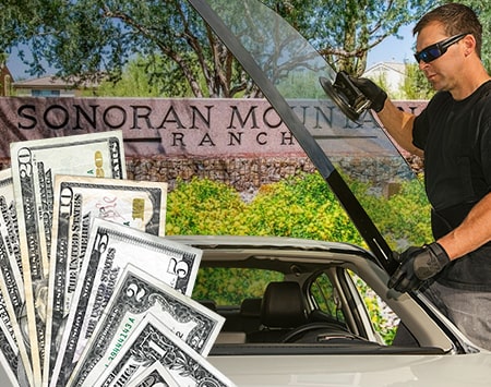 Technician fixing glass on Sonoran Mountain Ranch street