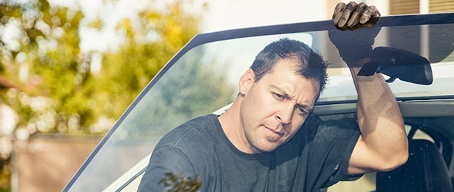 Technician holding windshield