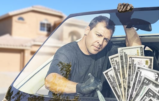 Technician removing old windshield